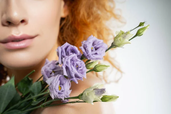 Girl with lilac freesias on her shoulder — Stock Photo, Image