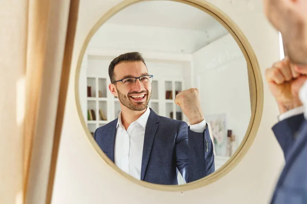 Pleased man in trendy clothes standing indoors — Stock Photo, Image