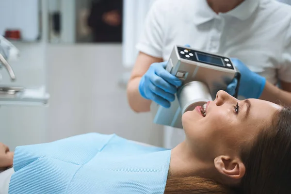 Happy young woman in dental office stock photo — Stock Photo, Image