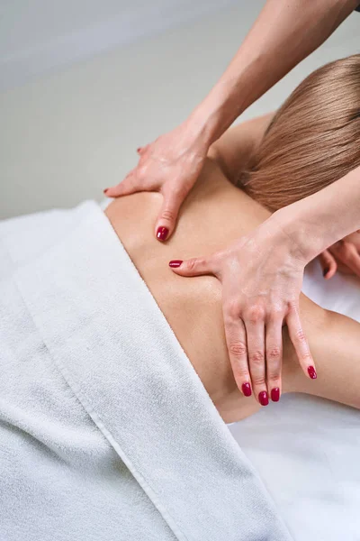 Professional practitioner doing massage for healthy back — Stock Photo, Image