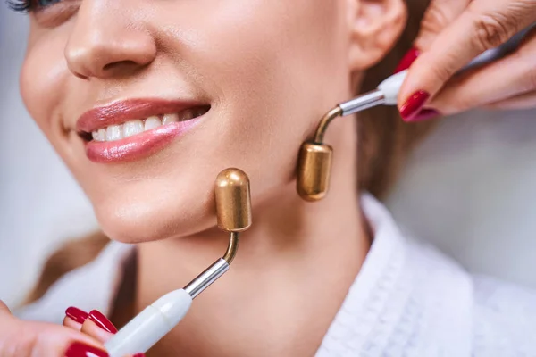 Cheerful woman enjoying beauty procedure stock photo — Stock Photo, Image