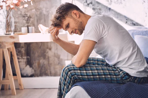 Serious young bearded man being deep in thoughts — Stock Photo, Image