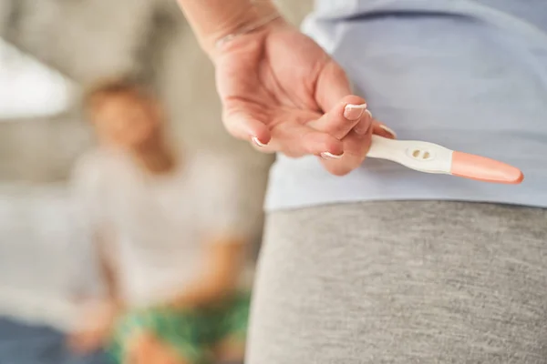 Close up of female that holding test for pregnancy — Stock Photo, Image