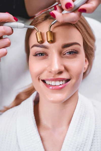 Happy woman during microcurrents procedure stock fotky — Stock fotografie