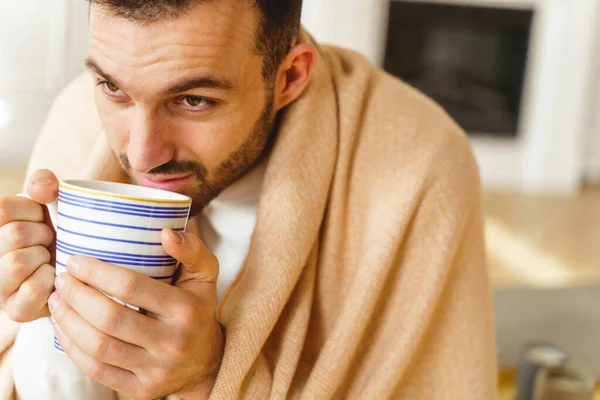 Male drinking a cup of chamomile tea — Stock Photo, Image