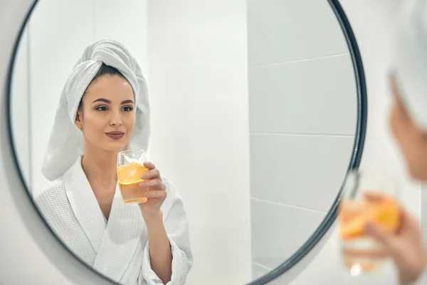 Beautiful cute woman enjoying beverage after shower — Stock Photo, Image