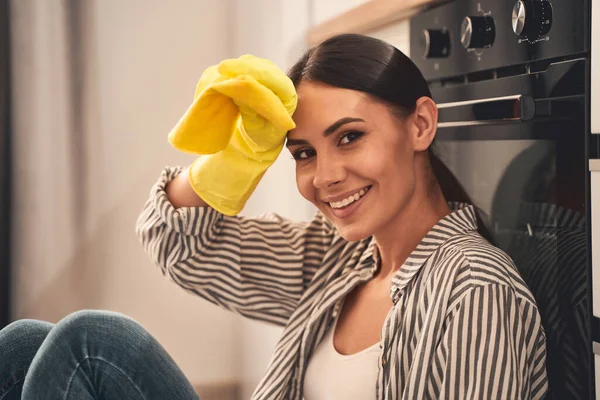 Positive delighted female person touching her forehead — Stock Photo, Image