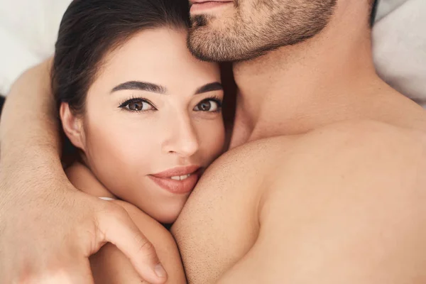 Serene woman resting on a mans chest — Stock Photo, Image