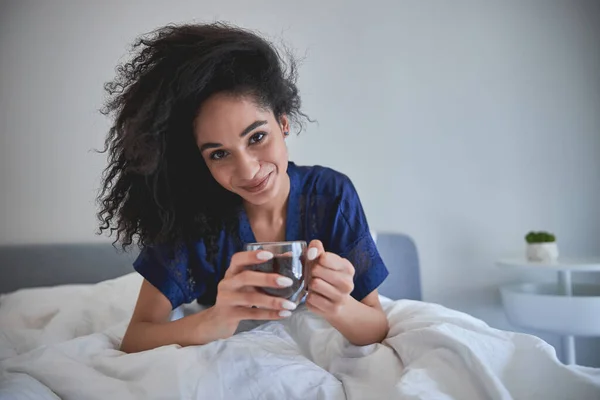 Tender female person going to drink coffee — Stock Photo, Image