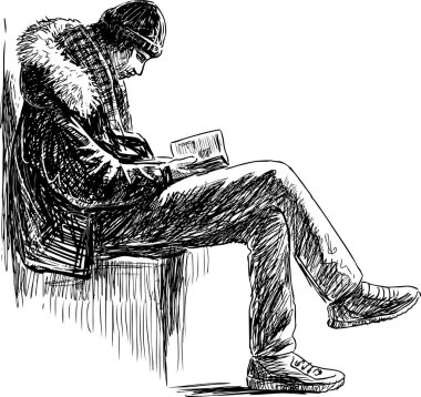 genç adam bir kitap okur