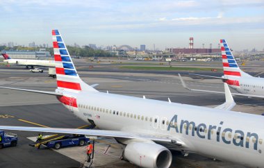 American Airlines aircraft at terminal at Airport clipart
