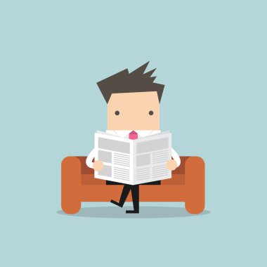 Oda ve office kanepede bir gazete okuyor işadamı