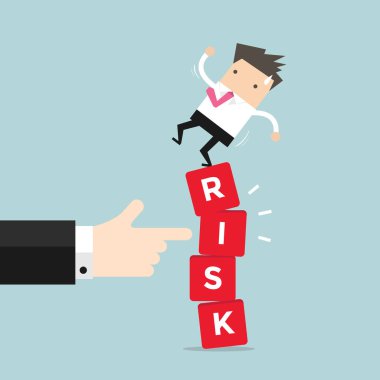 Titrek risk blok Yöneticisi el ile ayakta işadamı.