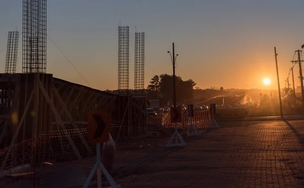 The hardware of a construction work in progress. Pedestrian walkway construction on highway in Brazil