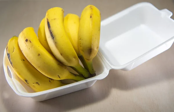 Bananas (Musa ssp.) For express delivery. Bananas in Styrofoam packaging for home delivery. Tropical fruit. Fruit delivery.