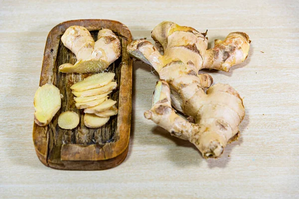 Ginger root. Ginger has a spicy flavor and can be used in both savory and sweet dishes and in several forms: fresh, dry, preserved or crystallized.