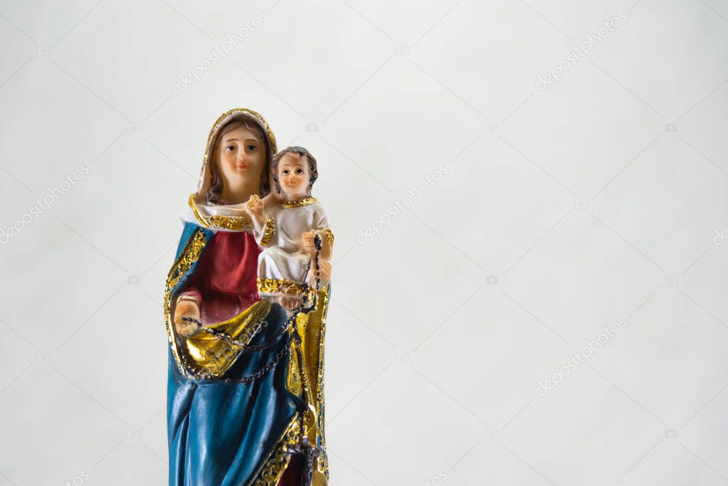Symbolism and religiosity. Image of saint of the catholic church. Symbol of faith and hope. Christianity. Dolls representing Catholic saints. Souvenir. Tourism and religious commerce. Catholicism.