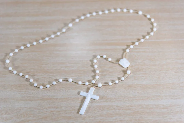 Rosary and religious crucifix. Symbols of Catholicism. Crucifix (Cross of Christ) is a symbol of veneration, which was initiated by Christians during the period after the crucifixion of Jesus Christ.