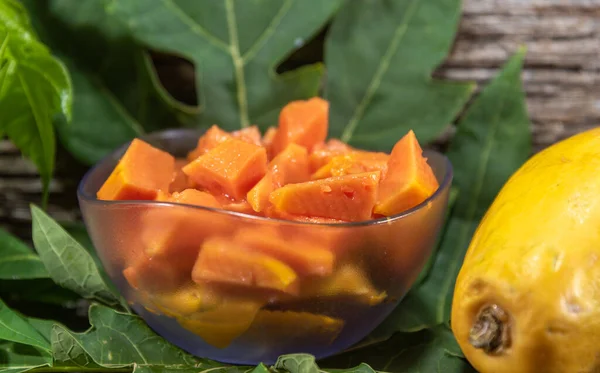 Chopped papaya fruit (Carica papaya L.) served in a bowl. The fruit, called papaya has this name because it has the shape of a breast, which earned it the popular name of papaya.