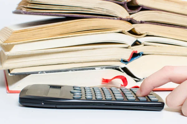 Pile of books and calculator — Stock Photo, Image