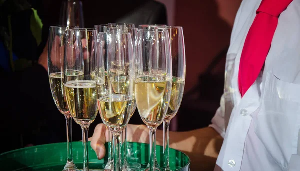 Glass of champagne at a celebration. — Stock Photo, Image