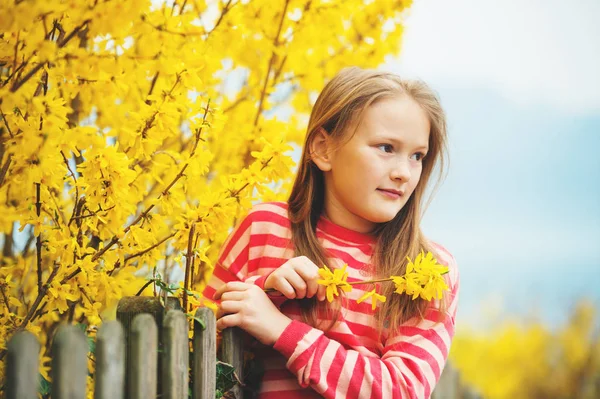 Spring portrait of adorable little girl wearing red stripe pullover — Stock Photo, Image