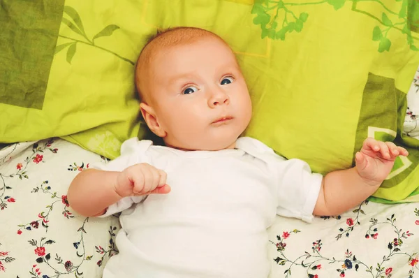 Close up portrait of adorable 4-5 month old baby lying on a pillow — Stock Photo, Image