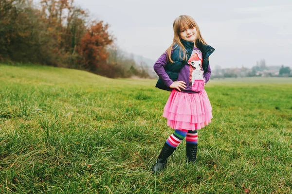 Outdoor portrait of little 5 year old girl in autumn, wearing pink tutu skirt — Stock Photo, Image