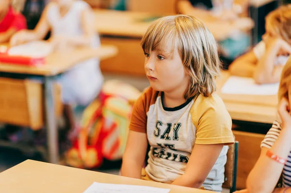 Concentrated Little Boy Listening Teacher Classroom — Stock Photo, Image