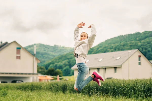 Outdoor Portrait Happy Jumpink Kid Girl Wearing Grey Sweatshirt Denim — Stock Photo, Image