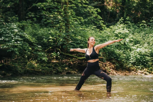 Young Fit Woman Practicing Yoga Standing River Wearing Black Leggings — Stock Photo, Image
