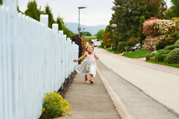 Little Girl Running Street Wearing White Dress Arms Wide Open — Stock Photo, Image