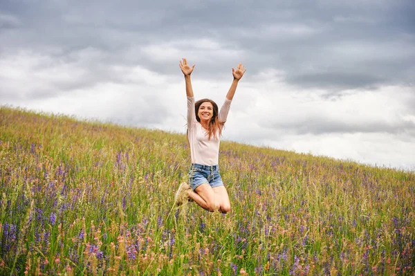 Young Beautiful Woman Hiking Field Wildflowers Excited Girl Jumping High — Stock Photo, Image