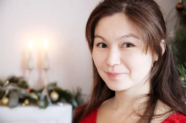 Beautiful smiling asian girl face portrait with candles on backg — Stock Photo, Image