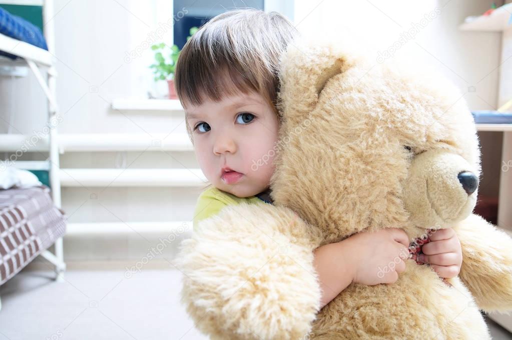 little girl with a teddy bear