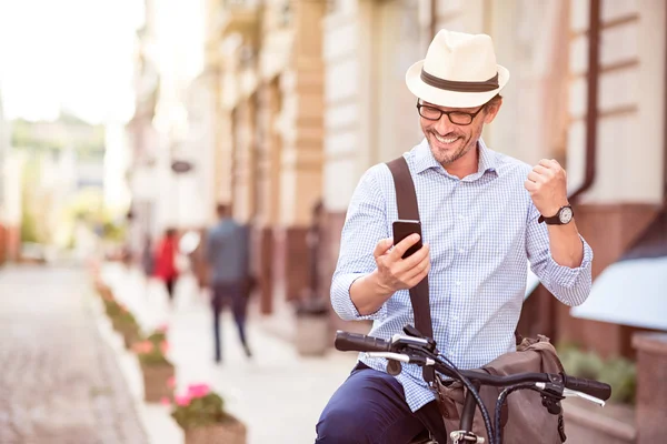 Cheerful man standing in the street