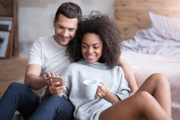 Happy couple watching their photos 
