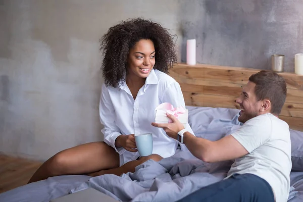 Man giving a present to his happy wife. — Stock Photo, Image