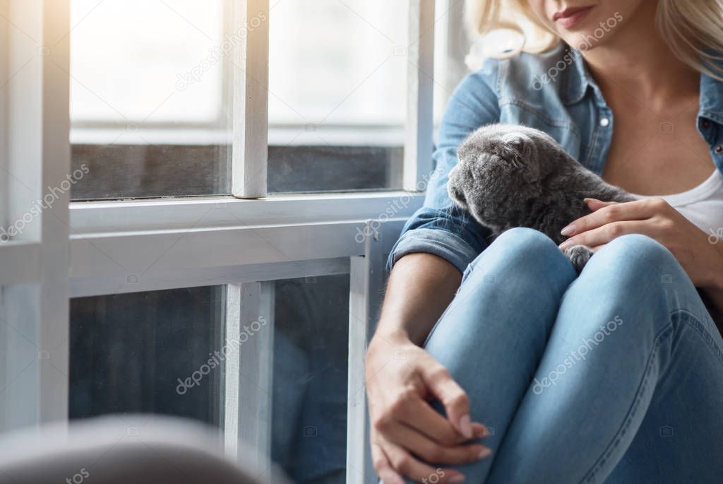 Close up of blond lady with cat