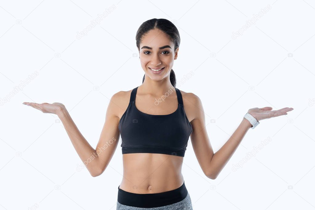 Positive delighted girl holding her hands up