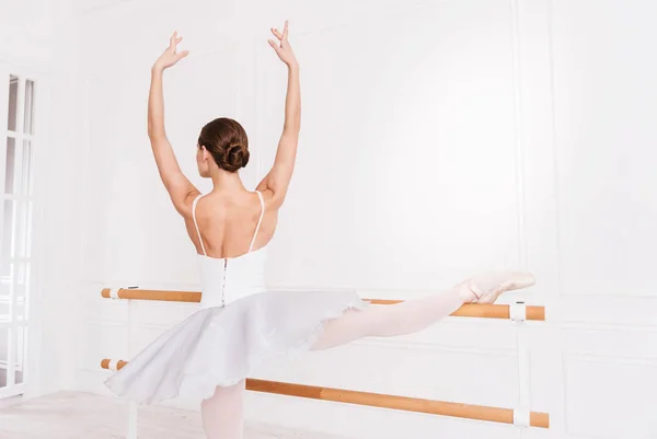 Tender ballerina keeping arms like in fifth position — Stock Photo, Image