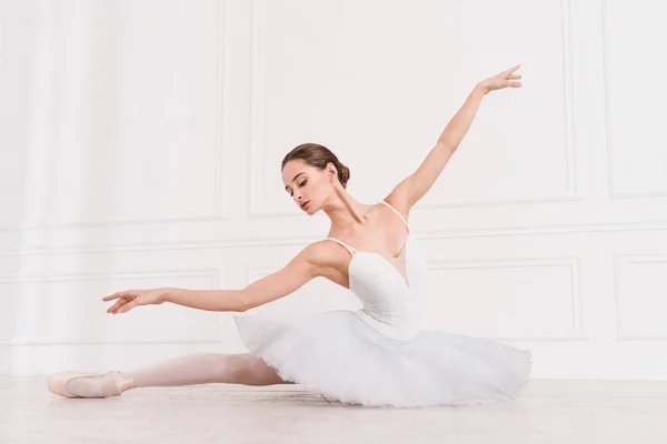 Graceful girl while doing ballet positions — Stock Photo, Image