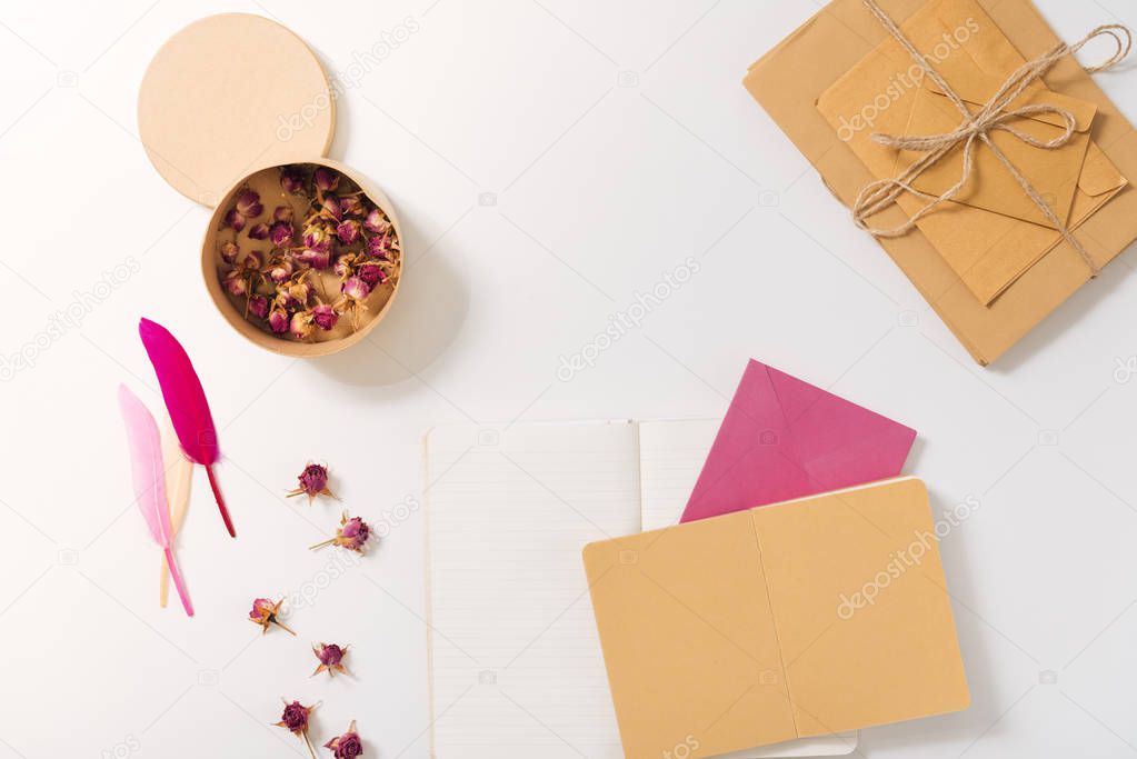 Box with dried flowers lying on the desk