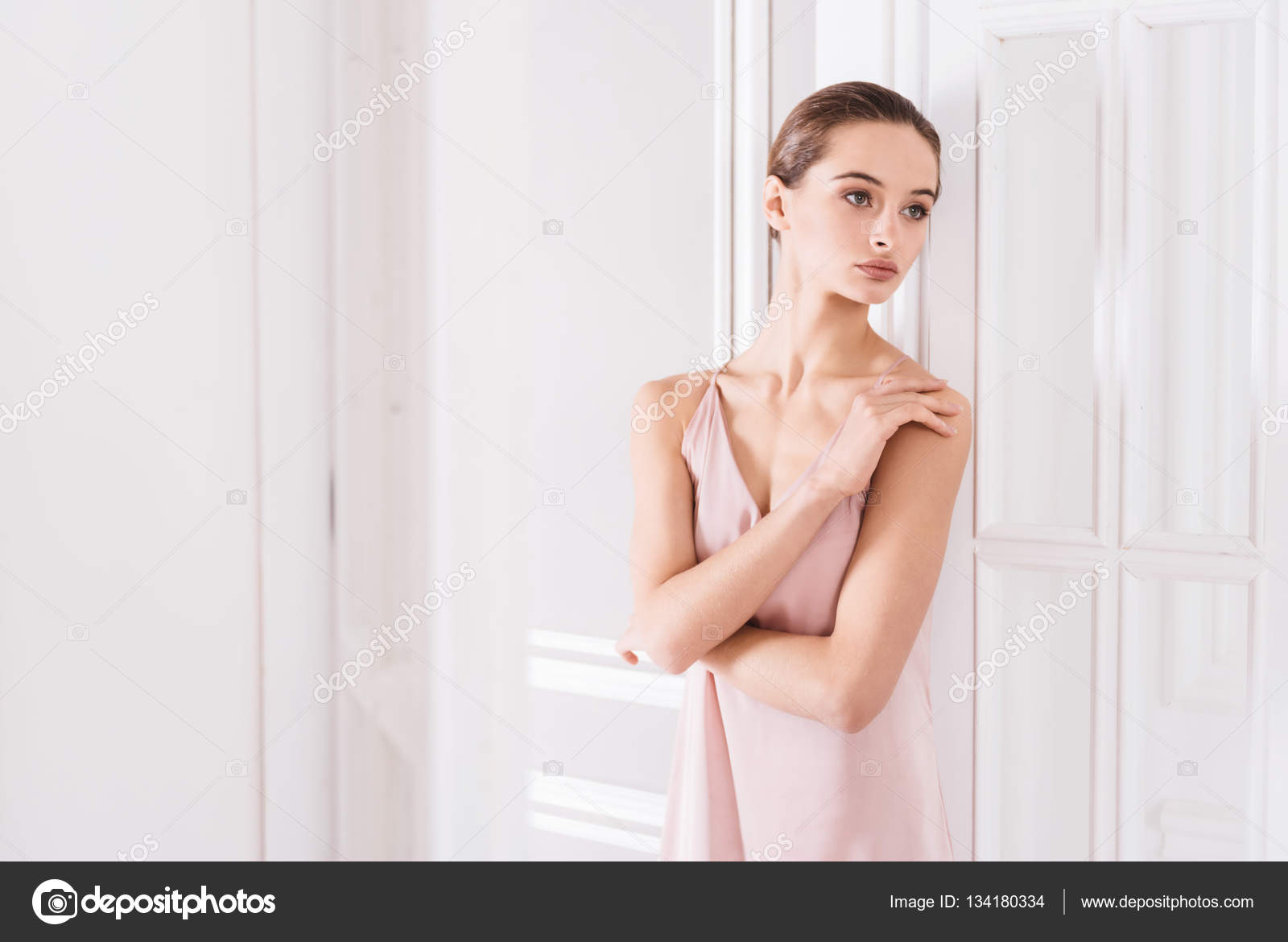 Delicate woman crossing her arms Stock Photo by Dmyrto Z 134180334