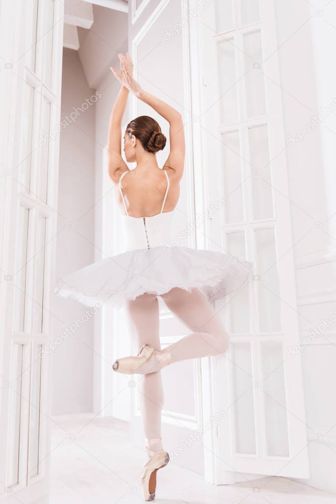 Young ballet dancer standing on tiptoes