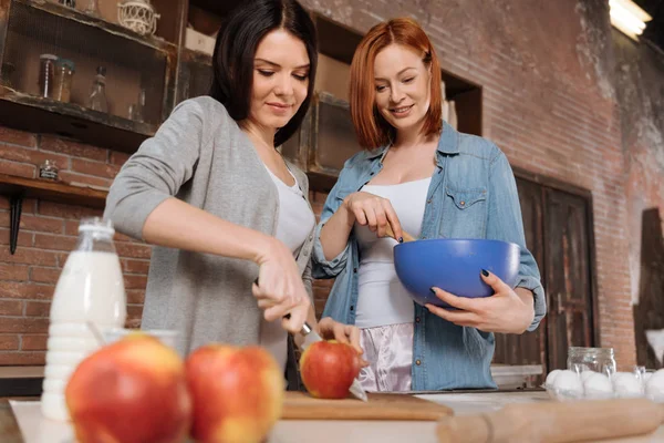 Positive delighted friends while cooking — Stock Photo, Image