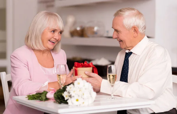 Elderly lady being emotional about her present — Stock Photo, Image