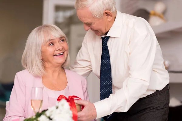 Magnificent smiling woman receiving a present — Stock Photo, Image