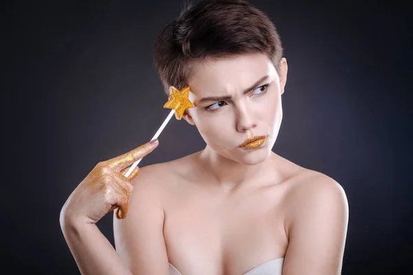 Thouhtful woman posing with lollipop — Stock Photo, Image