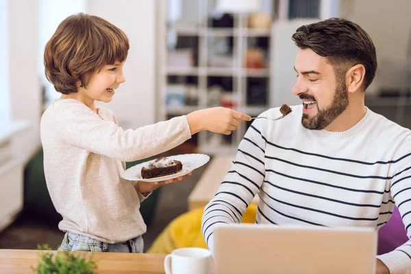 Handsome bearded man opening mouth for cake — Stock Photo, Image